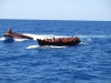 Fotografía de recuerso en la que Open Arms rescata una patera en el Mediterráneo. Open Arms