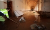 Labores de limpieza en el monasterio cisterciense tras la riada de septiembre de 2028. /SN